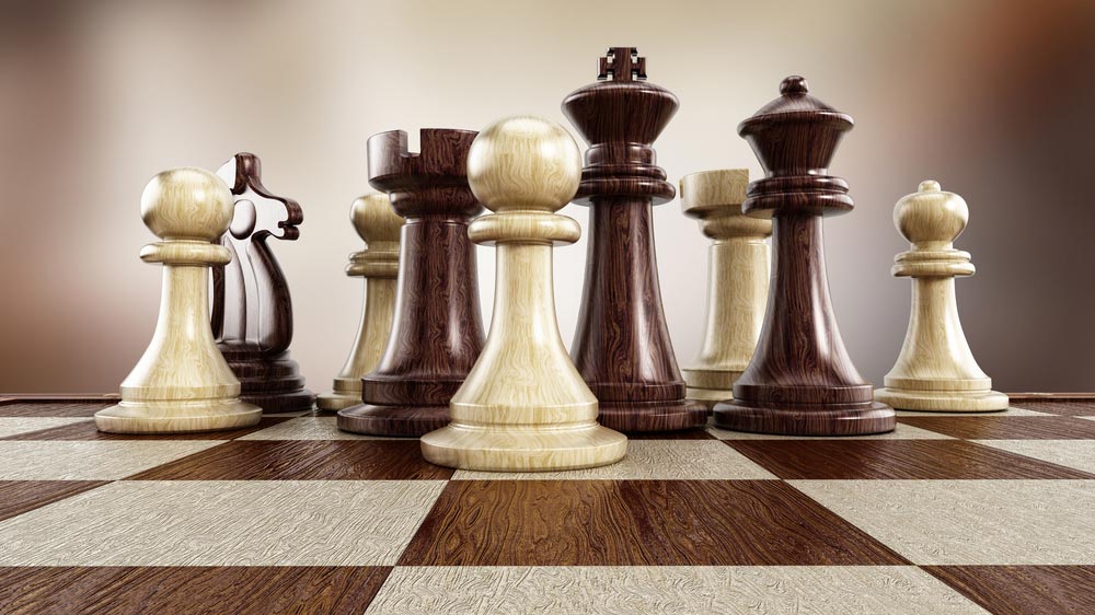 Different colored chess pieces mixed together