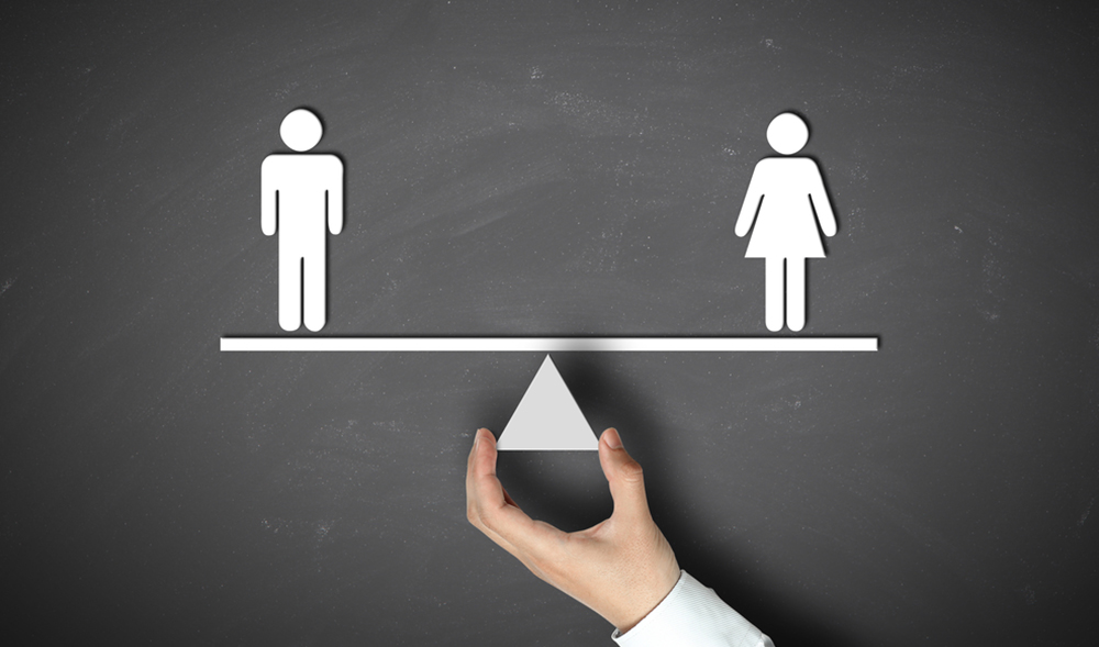 A scale which is equally balanced with a man and a woman on each end